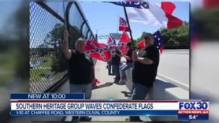 Southern heritage group waves confederate flags