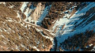 Bird-view of a serpentine road between rocks in a mountainous area