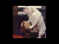 dog riding a rocking horse with