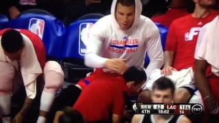 Blake griffin bench head from trainer during nets game