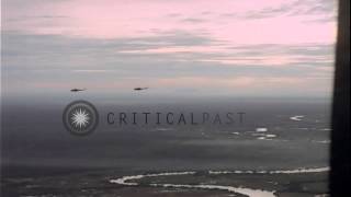 UH-1D helicopters in flight early morning during Operation Cedar Falls in Binh Du...HD Stock Footage