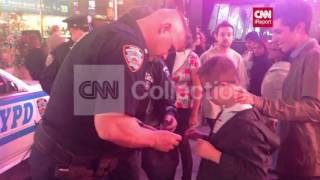 NY: NYPD OFFICER GIVES HAT TO SPECIAL-NEEDS BOY