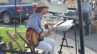 Spencer Scharf playing an Xaver grand concert guitar