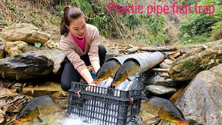 Ana traps fish with PVC pipes.