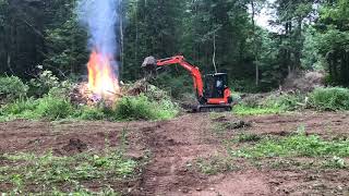 Time lapse video of burning brush piles with the Kubota KX040-4