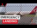 Qantas flight performs emergency landing in Brisbane | 7NEWS