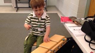 IMG 6721 Luke testing new percussion instrument at Violin Blast Off Aug 2015