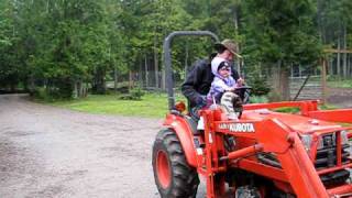 Ava driving the tractor - North Idaho living