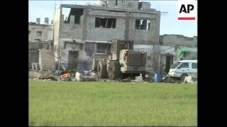 Israeli troops capture man; bulldozers pull down house