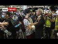 Riot officers try to disperse protesters occupying Hong Kong airport