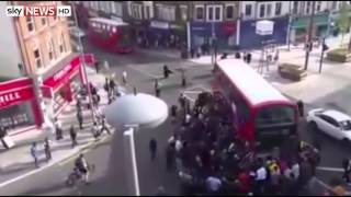 Amazing Moment A Crowd Lifts Double Decker Off Trapped Unicyclist