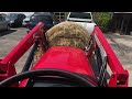 2021 mahindra 4540 lifting round bale of hay