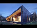 contemporary single story family house design wrapped in black steel at the foot of the mountains