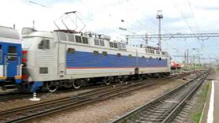 Electric locomotive CHS8-033, leading passenger train, is leaving Rossosh station.