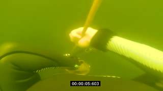 Freediving down into darkness to 30 meters in a flooded quarry in India