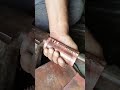 connecting the two edges of the copper sheet together making coppersmith satisfying