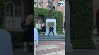 Protester spray-paints “Say no to genocide” on Tommy Trojan statue at USC