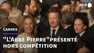 Cannes: montée des marches de l'équipe du film "L'Abbé Pierre : Une vie de combats" | AFP