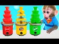 Monkey Baby Bon Bon eat jelly candy and plays balloons with ducklings in the swimming pool