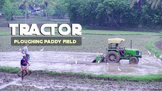 Tractor Ploughing Paddy field  | The beauty of Kerala Villages | Stock Footage