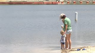 People enjoy Hope Mills Lake as a place to get relief from the heat in Cumberland County