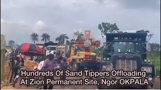 Hundreds Of Sand Tippers Offloading At Zion Permanent Site, Ngor OKPALA