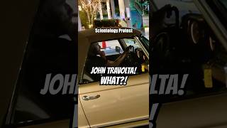 John Travolta visits Scientology protesters