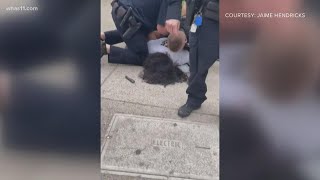 Louisville police officer under investigation after video appears to show him repeatedly punching ma