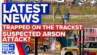 Car remains stuck on Sydney train tracks, Police suspect arson in NZ hostel fire | 9 News Australia