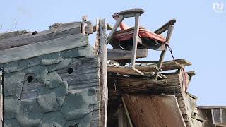 Chair dangling from roof of South Jersey house for years