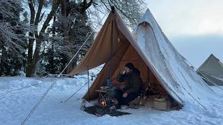 Relaxing by the snow lights and a bonfire. Solo camping at a snowy campsite