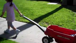 Lea pulling Liam in the wagon