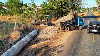 Dropping soil bury drainage system next to the road. Drivers passing by must be very careful.