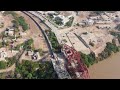 a passing train on lansdowne bridge drone shot 4k