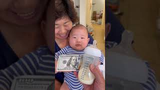 Will baby choose $100 or milk?? 🍼