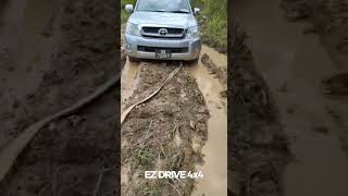 Stock standard Hilux takes on light muddy lumiri road in Nabawan