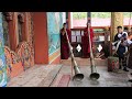 monks playing dungchen or tibetan horns at punakha dzong bhutan