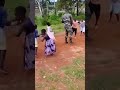 Malawi defence force soldier having having fun playing with kids from the village