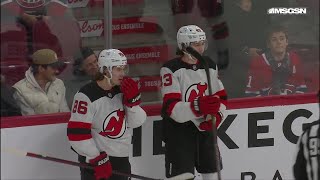 Luke Hughes scores a goal against the Montréal Canadiens