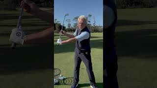 The key to keeping your left arm straight in the golf swing