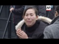 relatives of the people who died in a new year s eve stampede in shanghai china visited the disaste