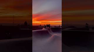 Breathtaking View: Skateboarders Making Moves During a Spectacular Sunset at Venice Beach Skate Park