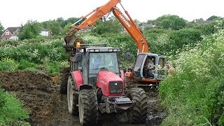 Emptying the Muck / Slurry Lagoon with Hitachi Digger - MF and JD Spreading it