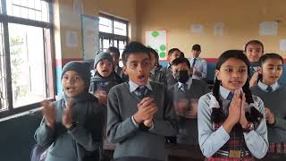 Students of Grade 5, singing their class song, \