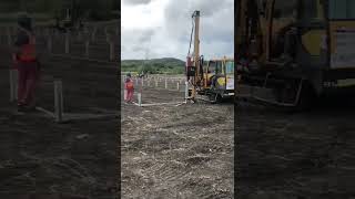 Solar pile driver working for solar project.