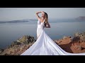 a superlative flying dress photoshoot in santorini