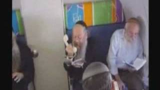 50  israeli Jewish rabbis on a plane singing (they look drunk or mad)