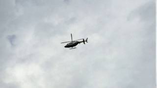 QUICK GLIMPSE OF A NYPD CHOPPER PATROLLING OVER THE BUSHWICK AREA OF BROOKLYN IN NEW YORK CITY.