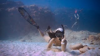 One Diver Relaxes as the Other Works Hard to Set Up a Line for a Buoy Behind lol