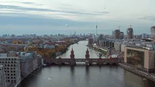 Berlin Establishing Shot of Cityscape Skyline with Spree River, Oberbaum Bridge and construction